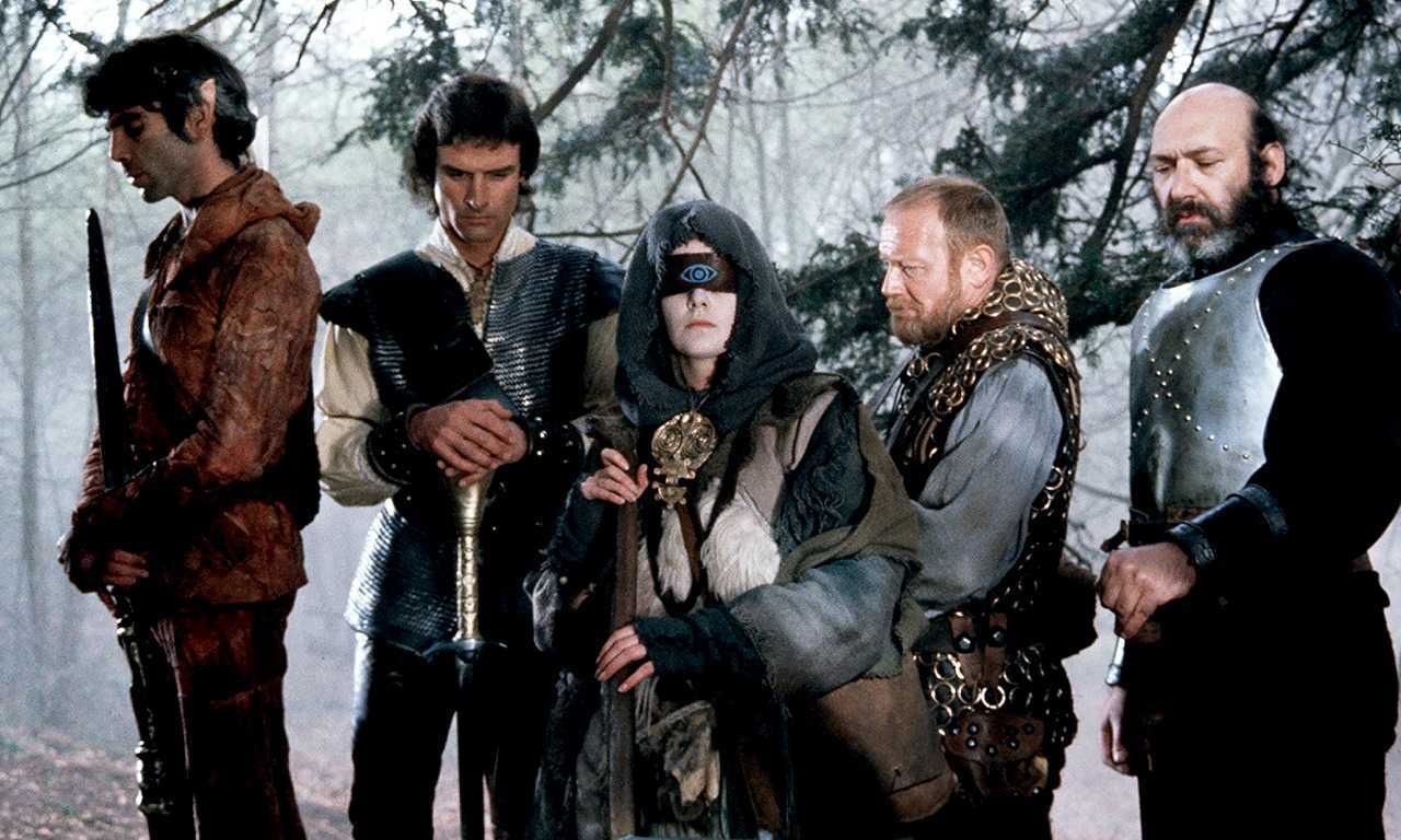 Crow (Ray Charleson), Hawk (John Terry), The Witch Woman (Patricia Quinn), Ranulf (Morgan Sheppard) and Gort (Bernard Bresslaw) in Hawk the Slayer (1980)