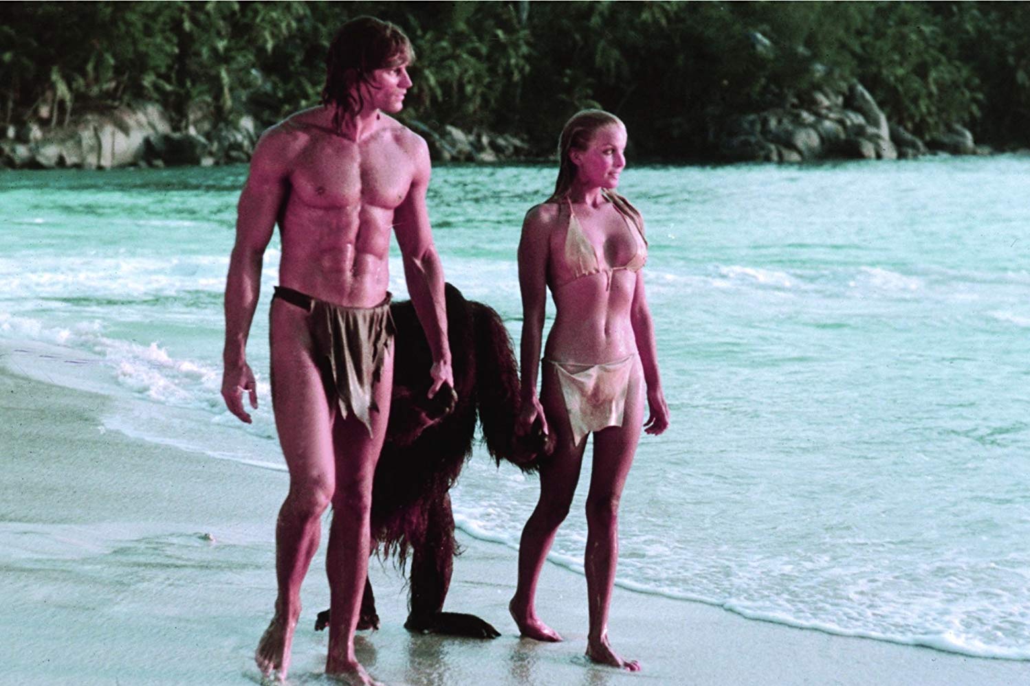 Tarzan (Miles O’Keeffe) and Jane (Bo Derek) with Cheeta amid the beautiful ...