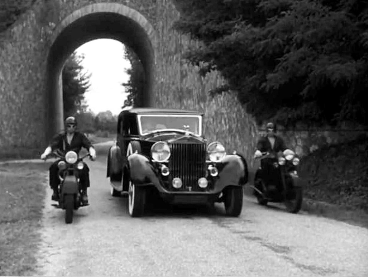 The Princess's car and her angelic escorts in Orphee (1950)