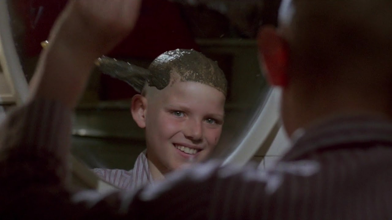 Matthew Mackay applies peanut butter to his hair in The Peanut Butter Solution (1985)