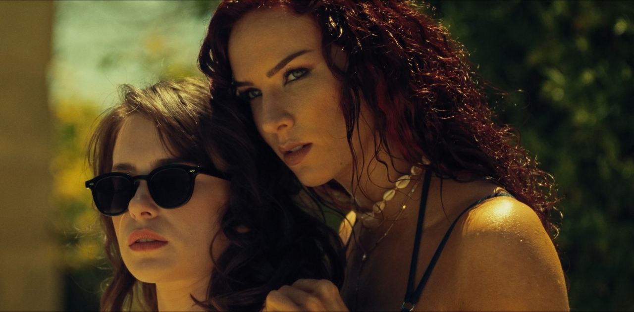 Charlotte Kirk and Anna-Maria Sieklucka in Compulsion (2024)