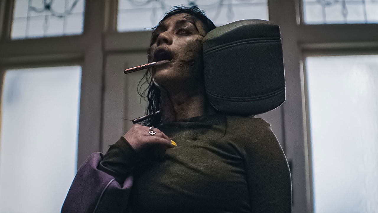 Luciane Buchanan and car seat headrest in Evil Dead Burn (2026)