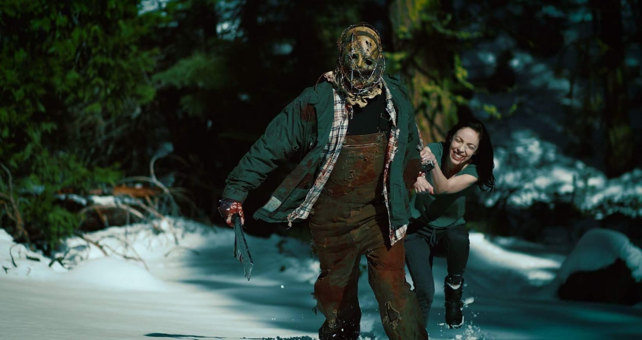 Nicole Stark and the killer in Playing with Dolls: Havoc (2017)