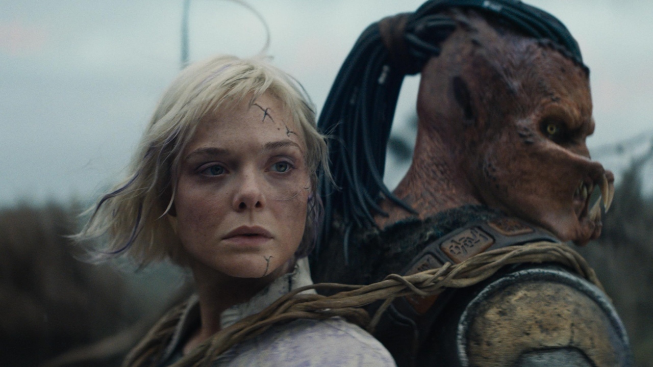 Thia (Elle Fanning) and Dek (Dimitrius Schuster-Koloamatangi) in Predator: Badlands (2025)