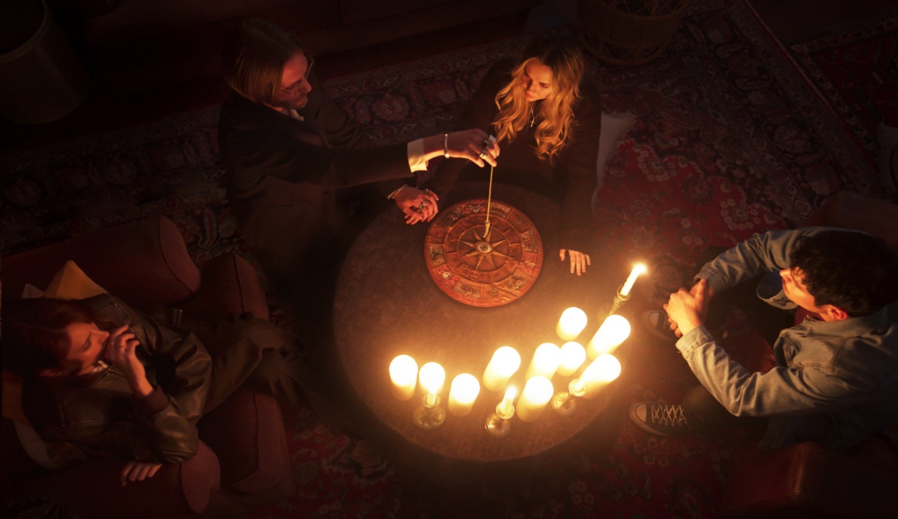 Jamie Campbell Bower and Madison Iseman in Witchboard (2024)